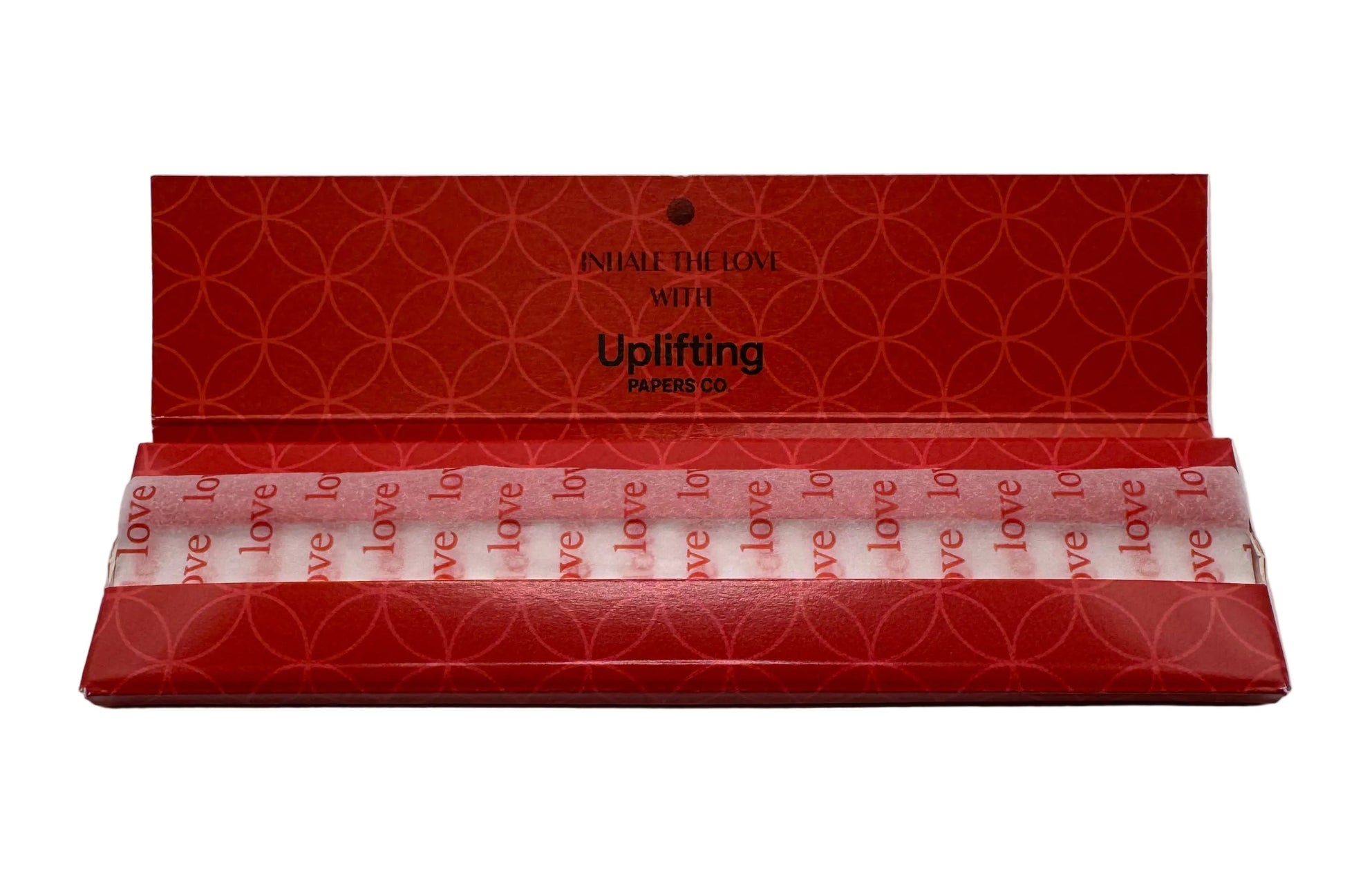 Red product packaging with geometric pattern on a gray background